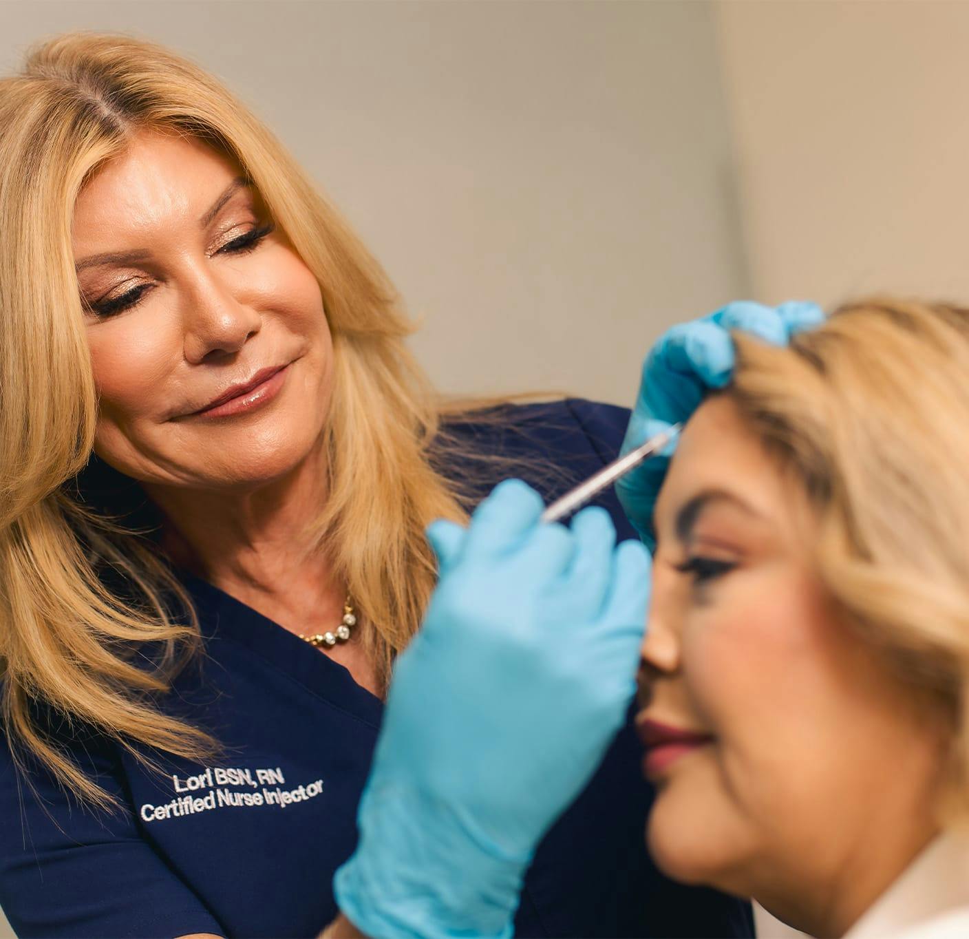 woman getting forehead injection by medspa specialist