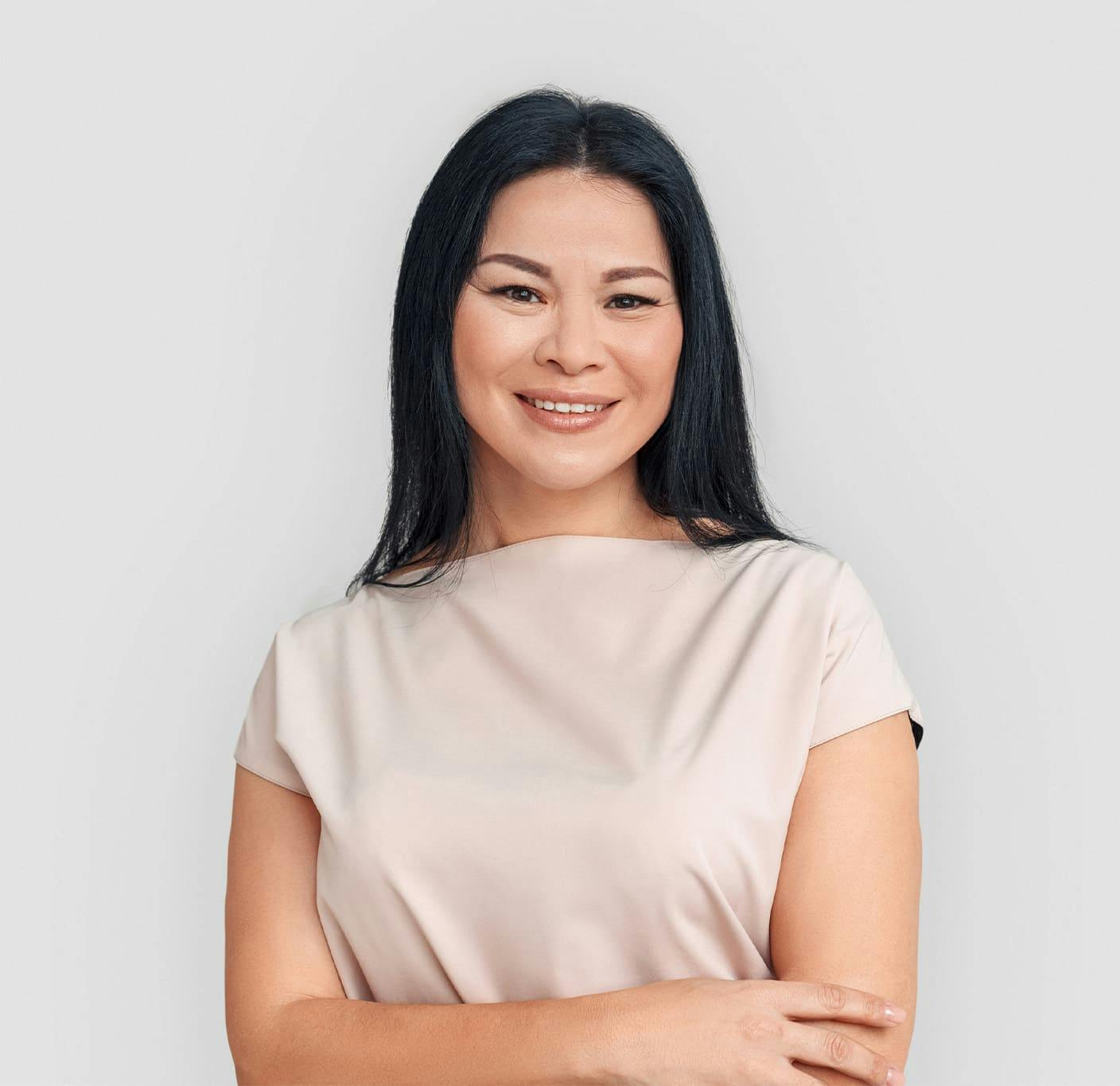 smiling woman crossing her arms