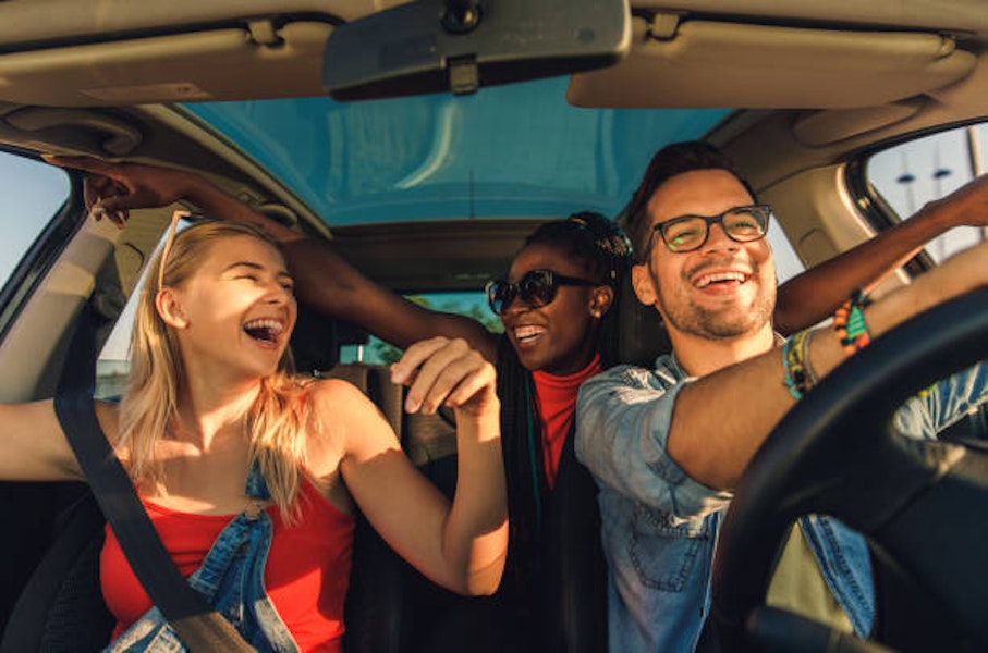people laughing in a car