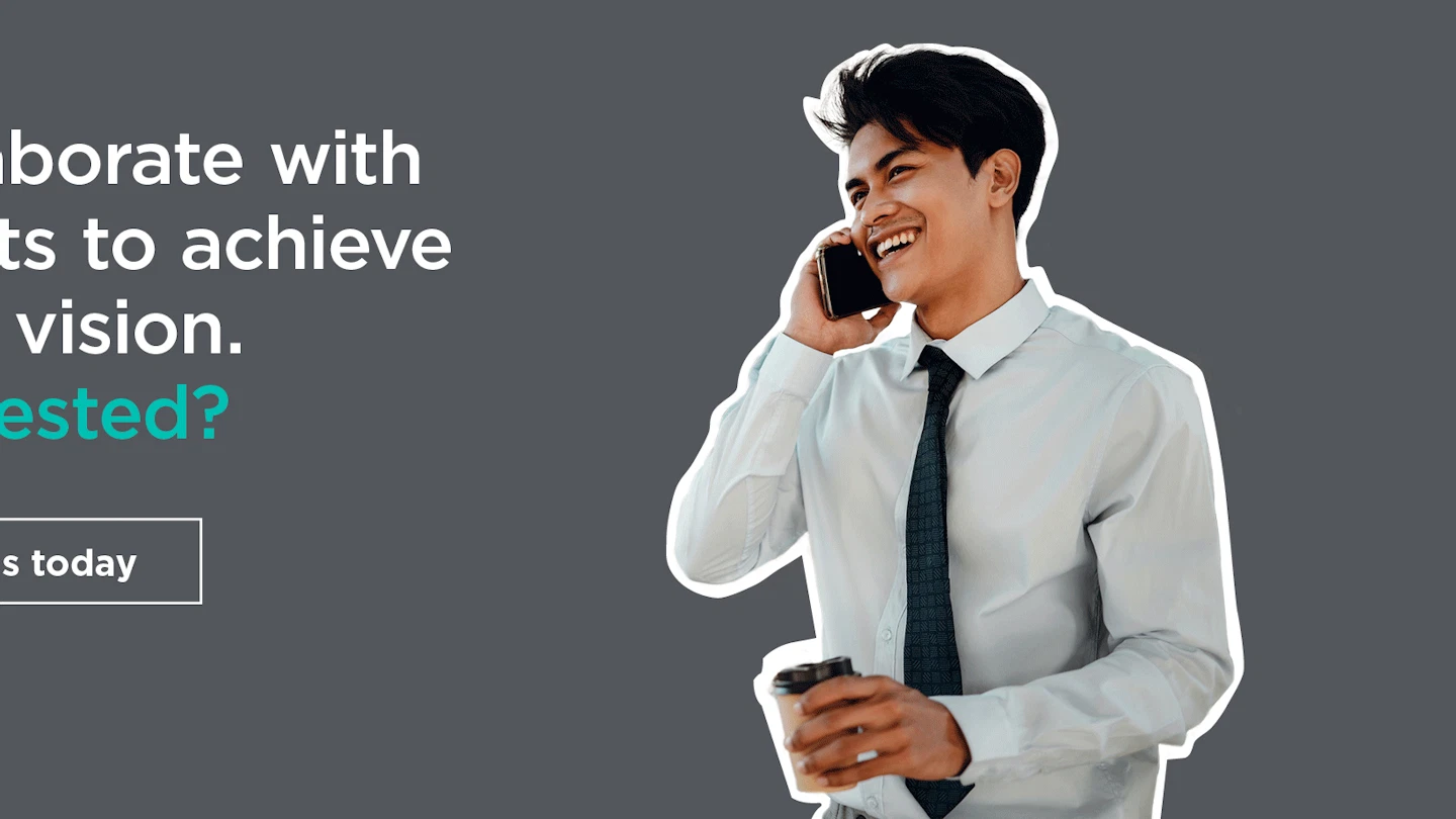 Man holding coffee talking on the phone