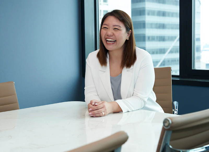 Woman laughing in office