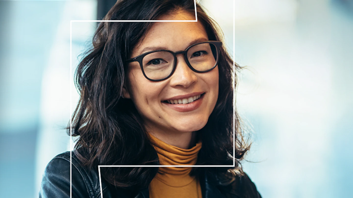woman with glasses smiling