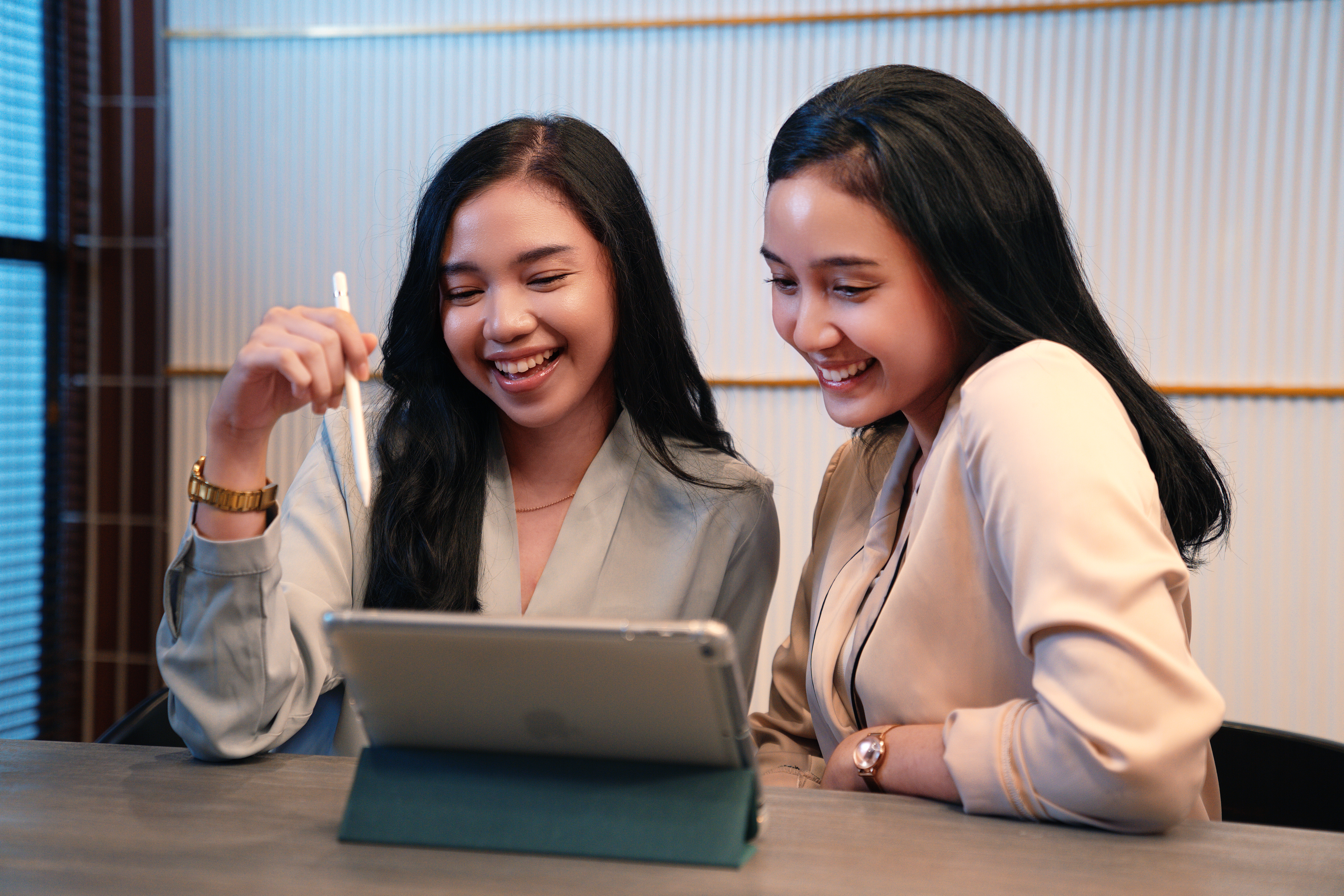 ID - women at a desk looking at an ipad