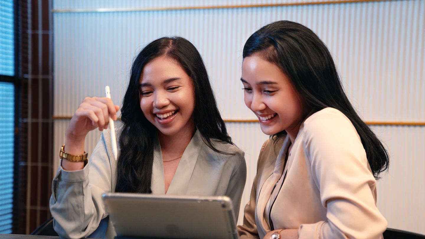 ID - women at a desk looking at an ipad