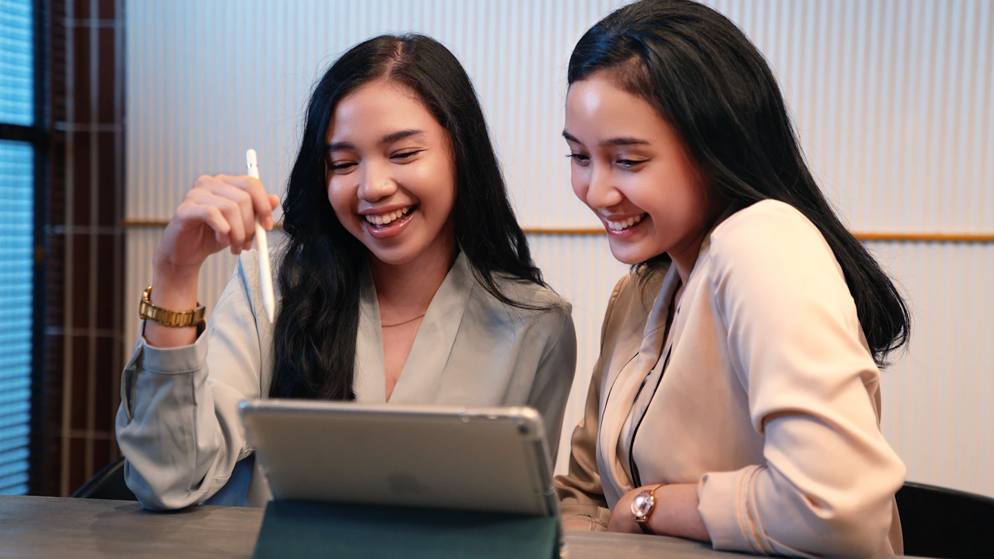 ID - women at a desk looking at an ipad