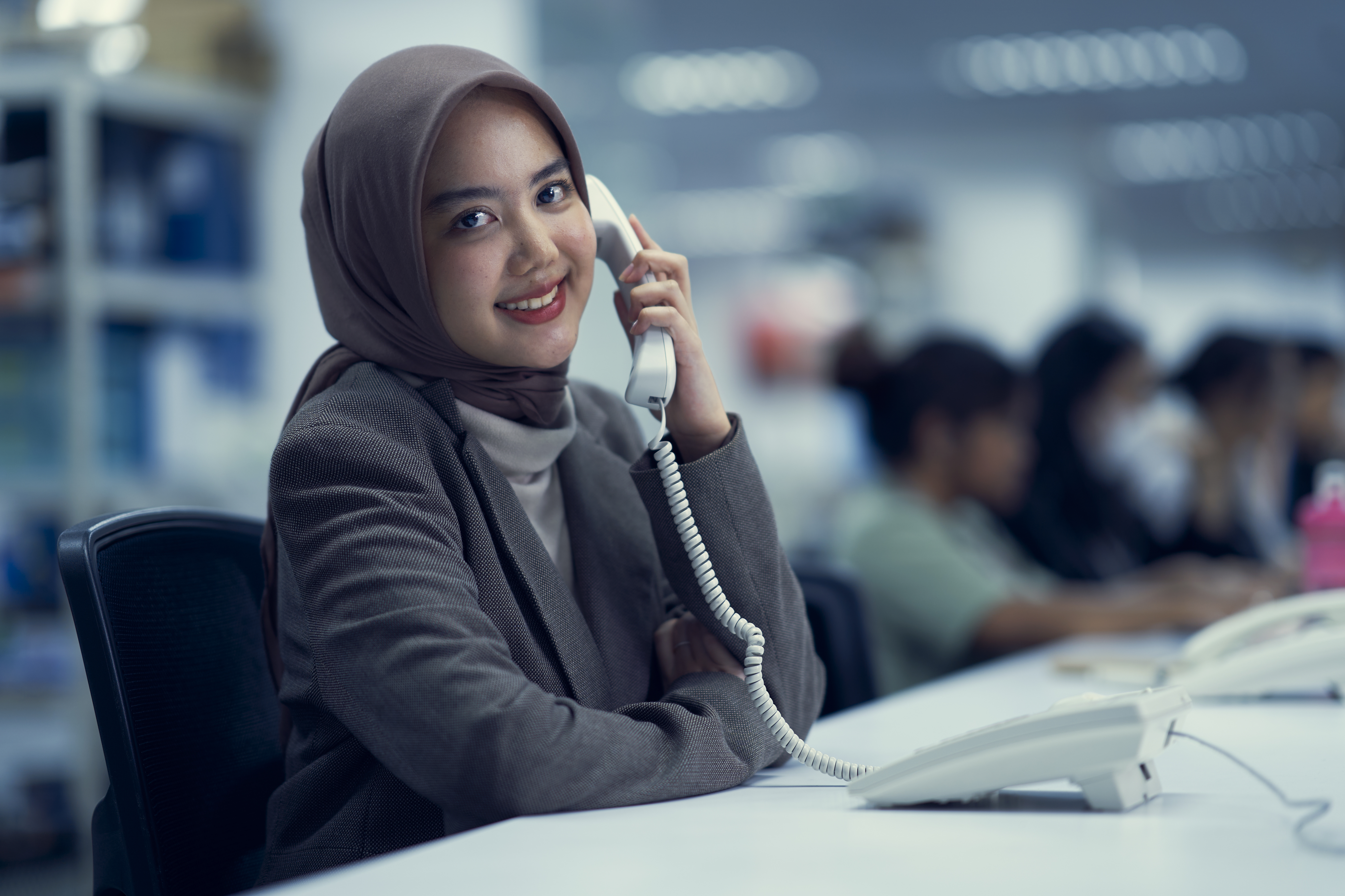 ID - woman on a phone at work