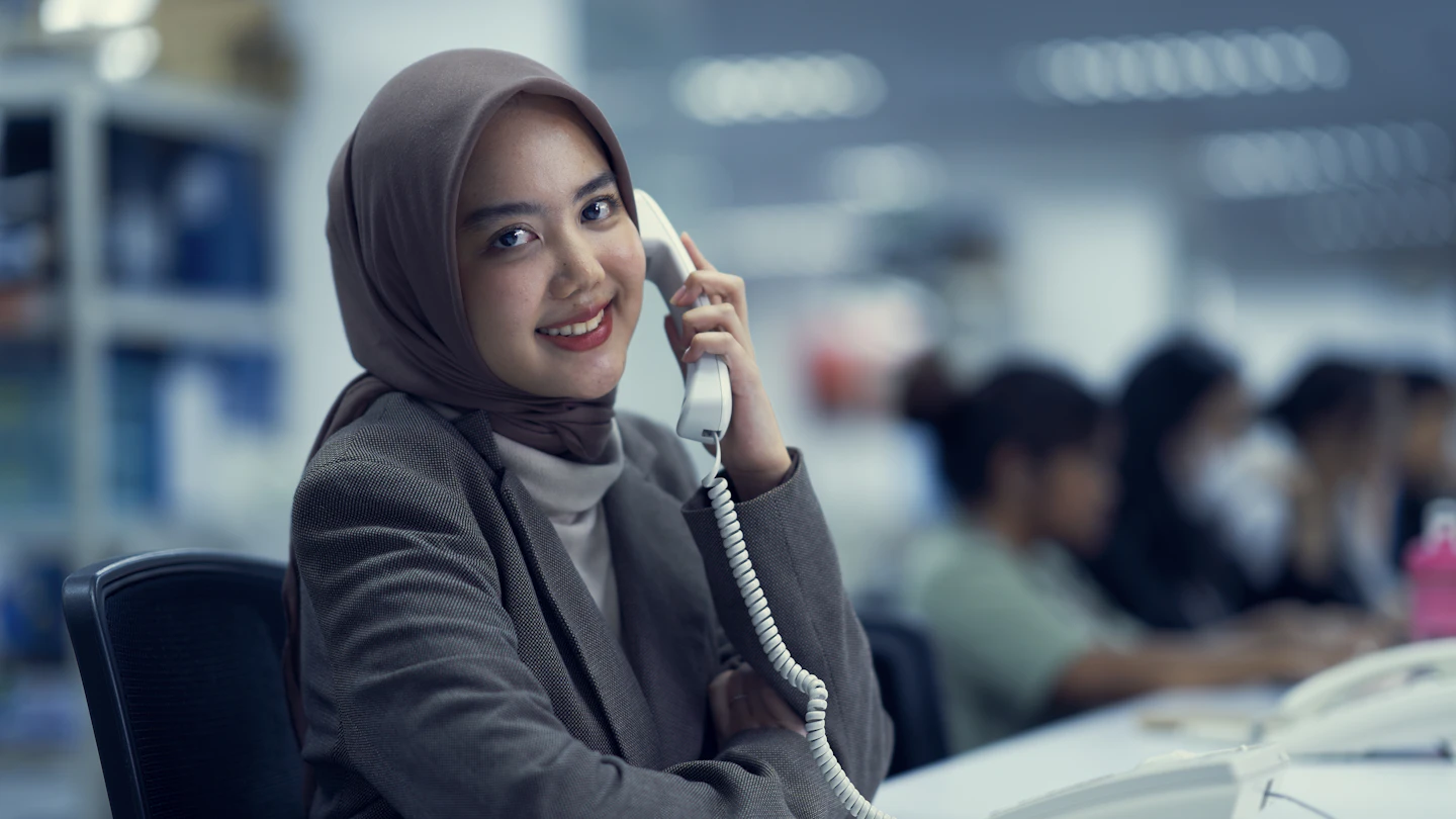 ID - woman on a phone at work