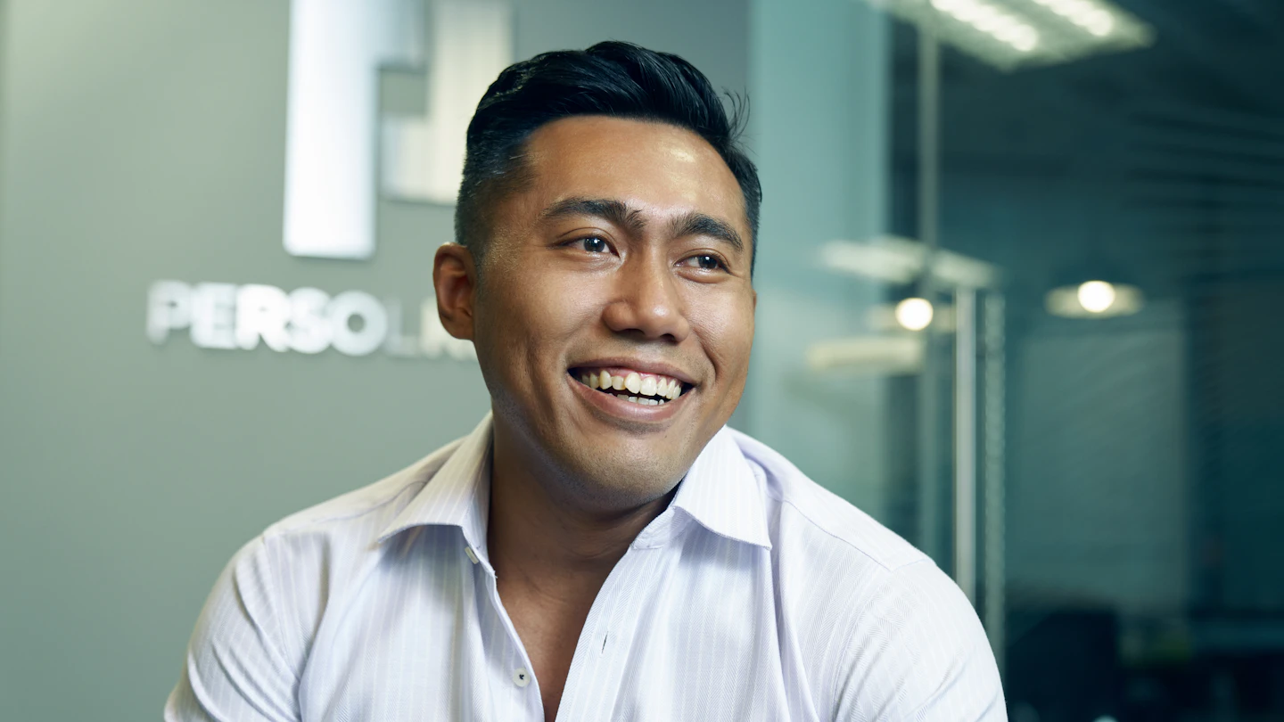 Permanent Staffing Solutions Built on 42 Years of Malaysian Market Knowledge Malaysian recruitment consultant talking with a client in a bright office
