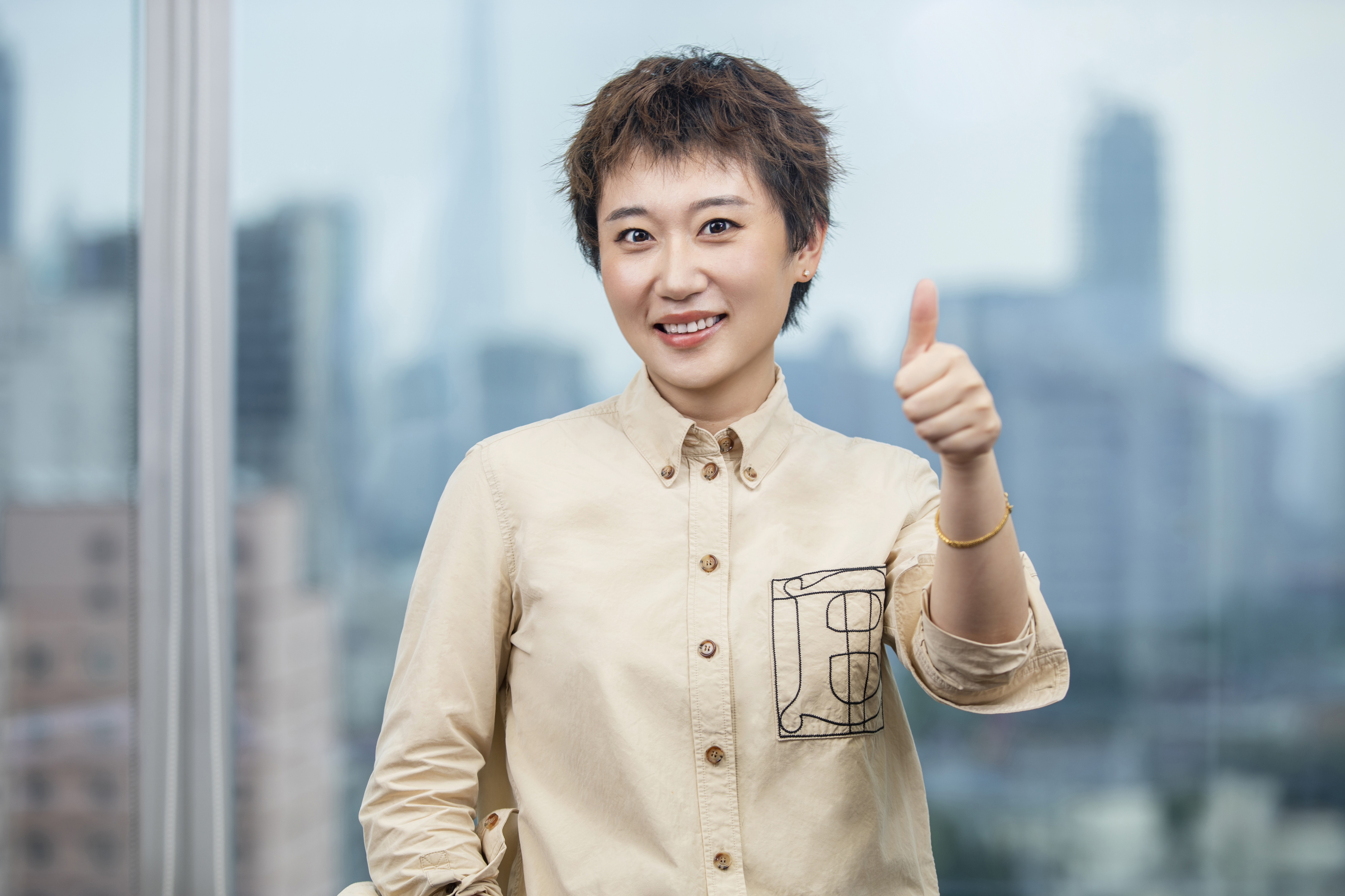 HK -  smiling woman giving thumbs up
