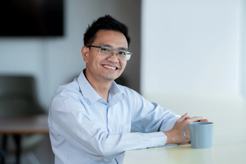 TH - smiling man with glasses