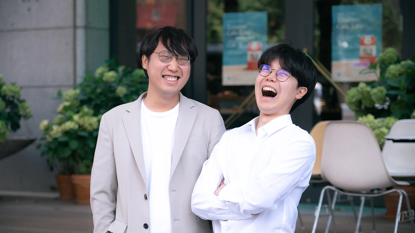 KR - two smiling men in business attire