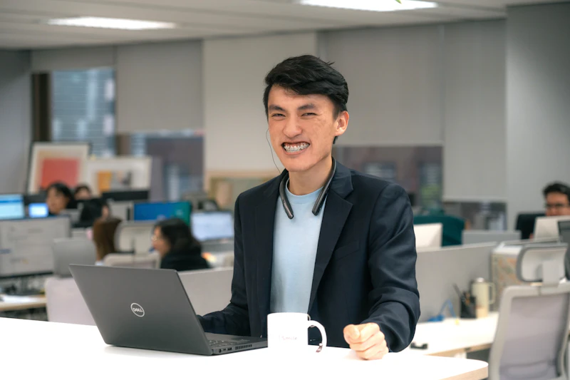Smiling man sitting at office desk