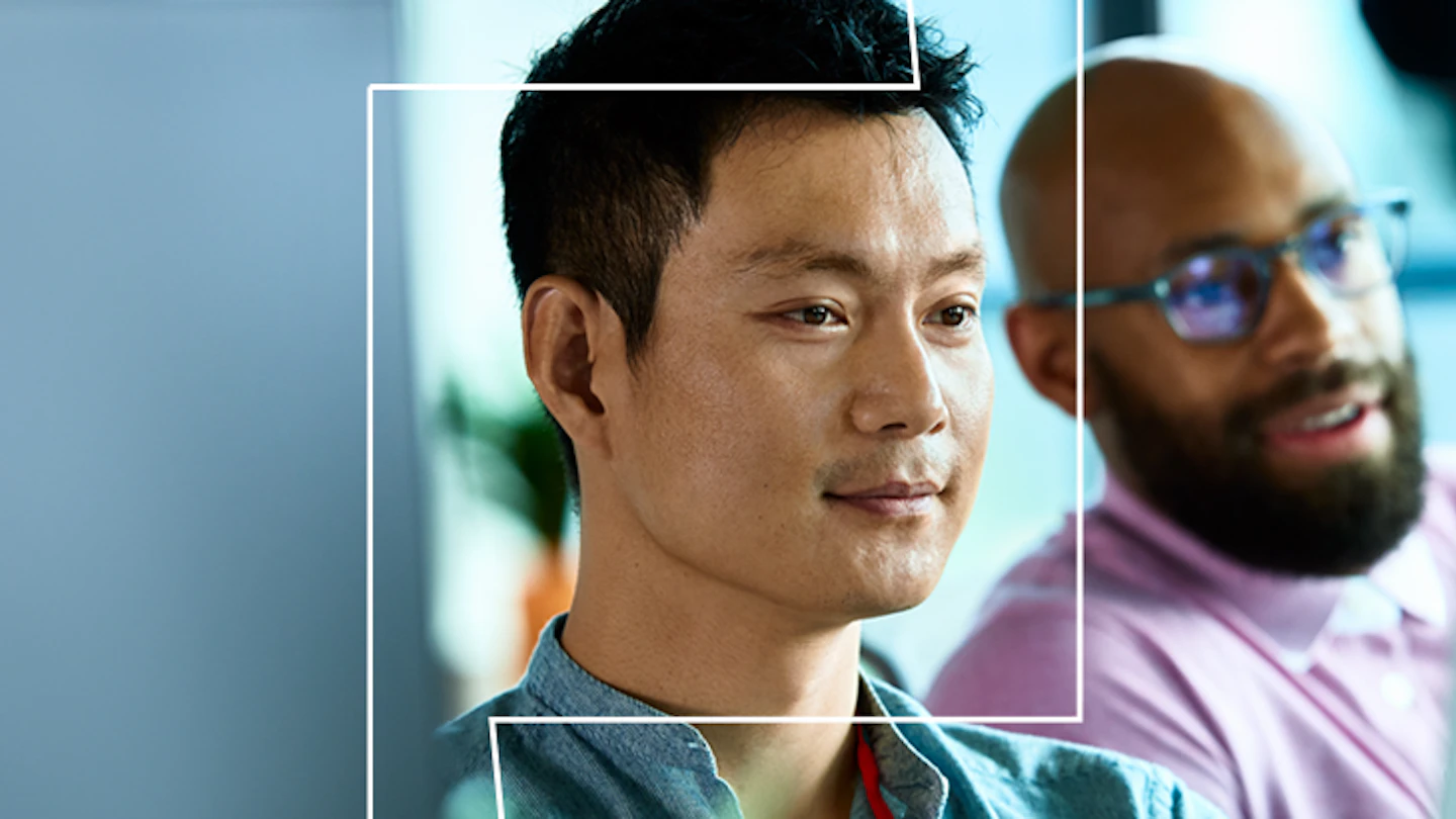 Close up picture of two men looking off camera