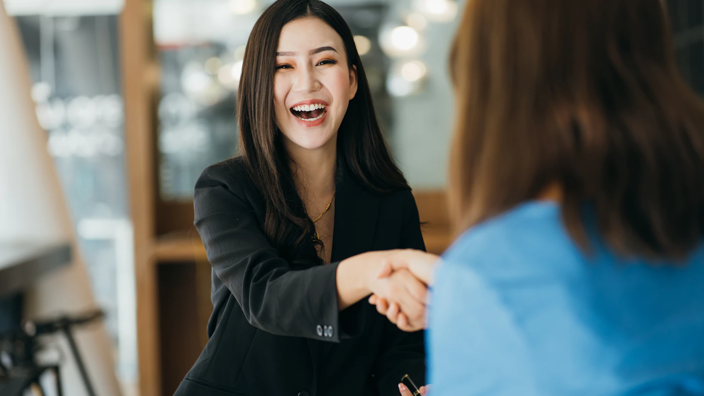 PSK MY Why Us Woman shaking hands