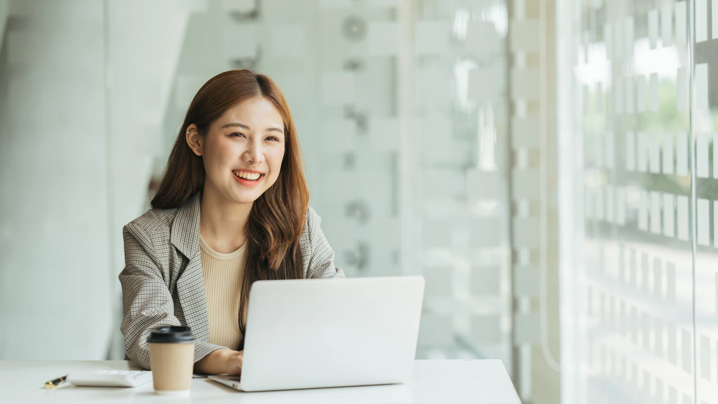 VN About Us Woman on laptop