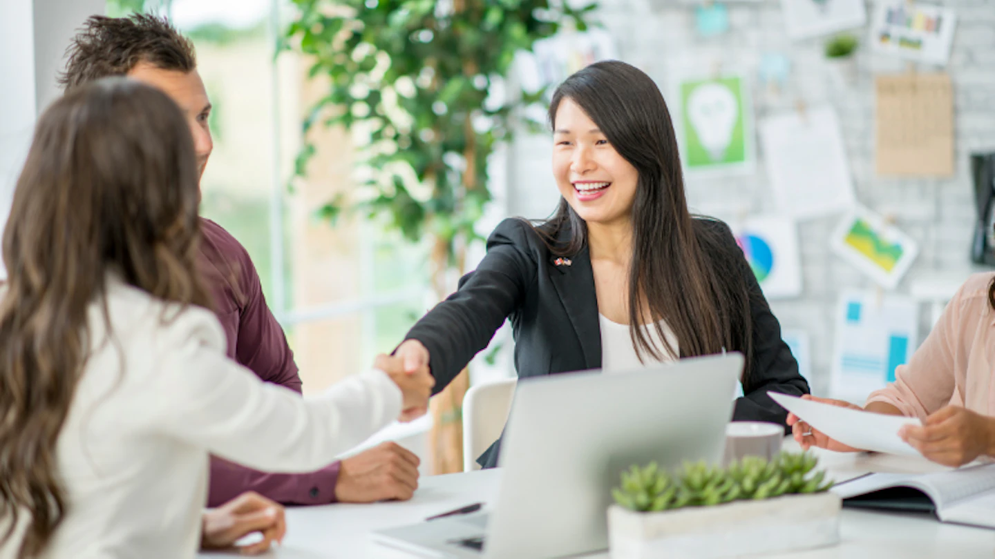 shaking hands in office