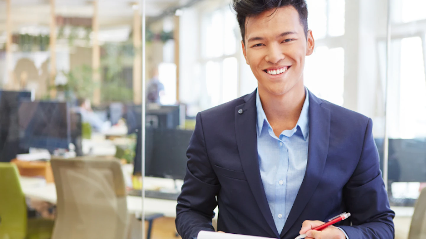 asian man with note pad