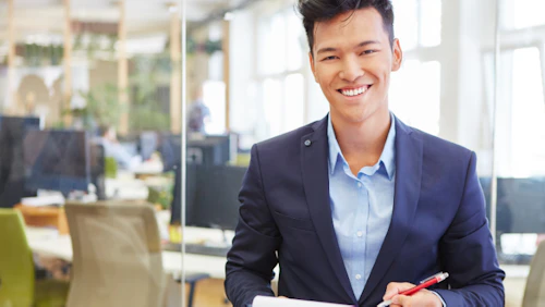 asian man with note pad