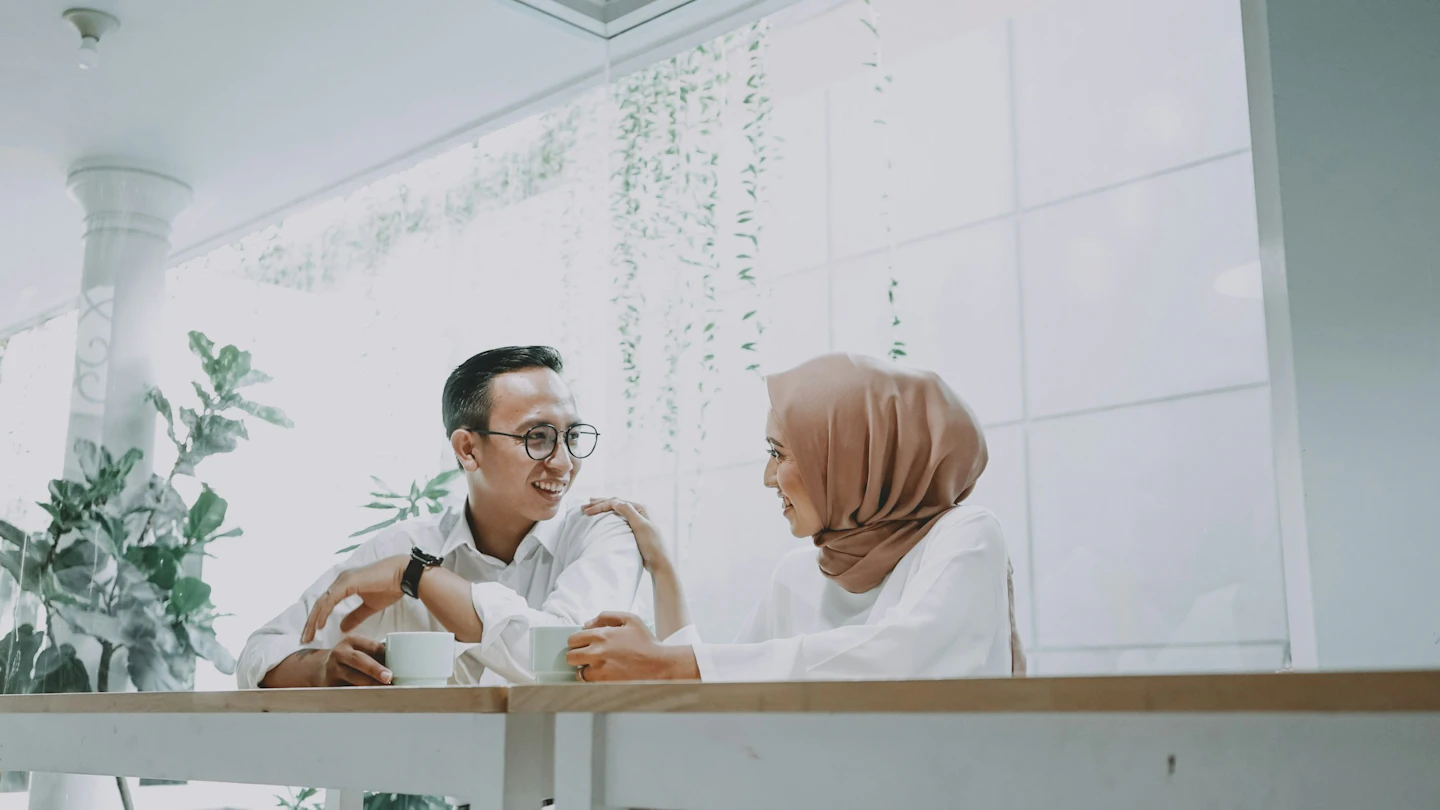 Indonesia hiring man in white dress shirt sitting on brown wooden chair