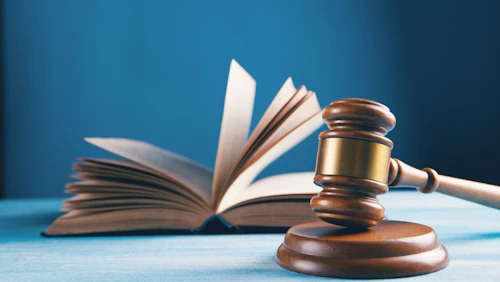 compliance open book on brown wooden table