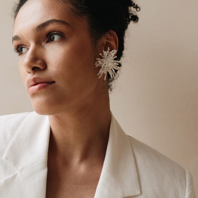 Woman with curly hair looking to the side