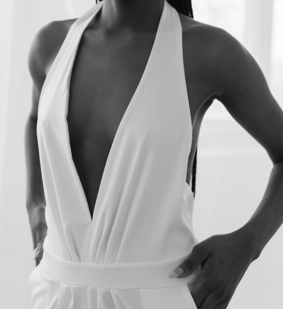 woman in a white halter top