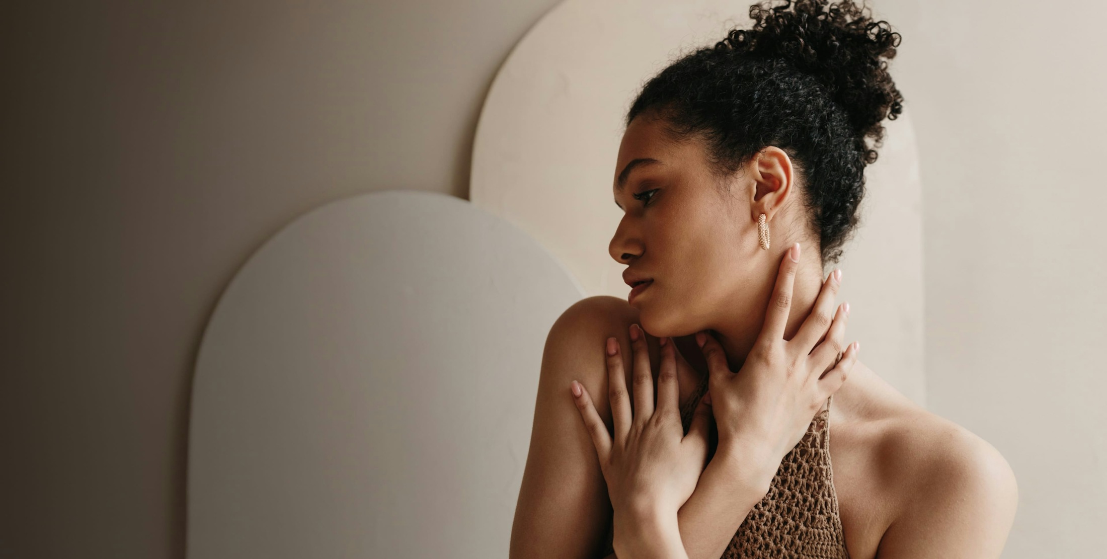 Woman with her arms to her body