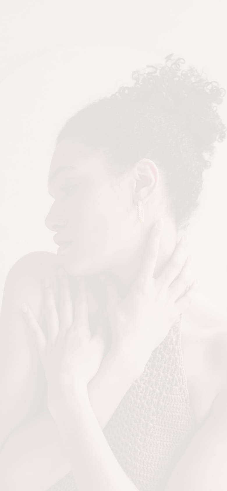 Faded image of a woman with both hands to her body