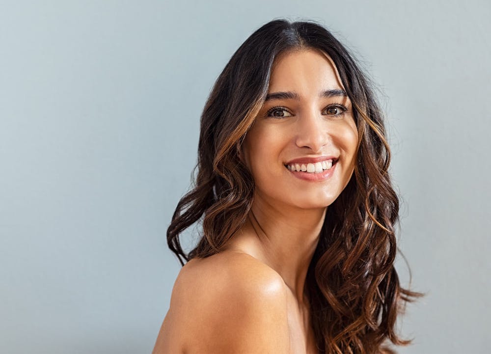 woman smiling over shoulder