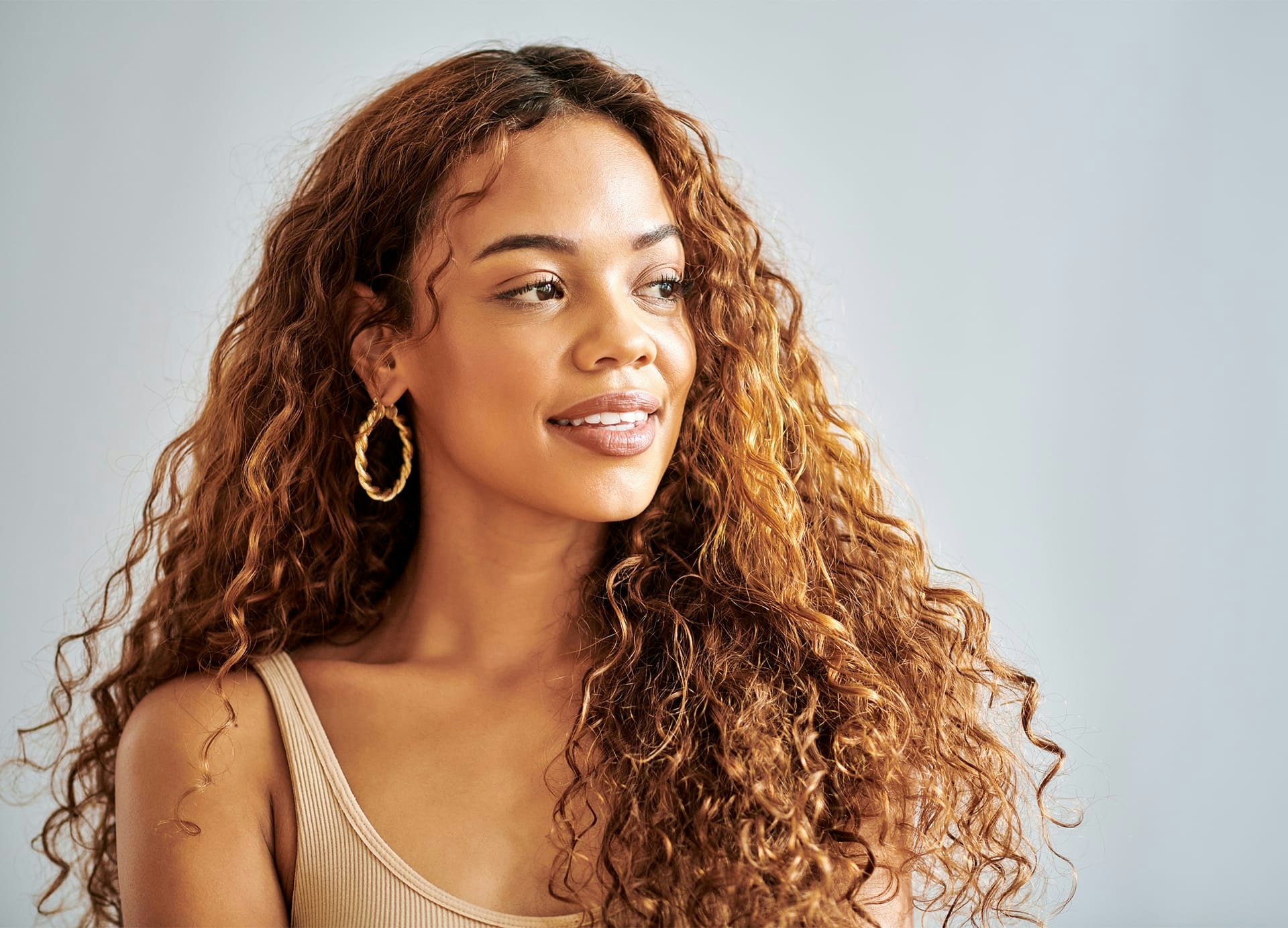 smiling woman with curly hair