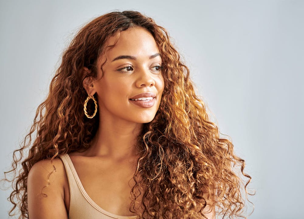 smiling woman with curly hair