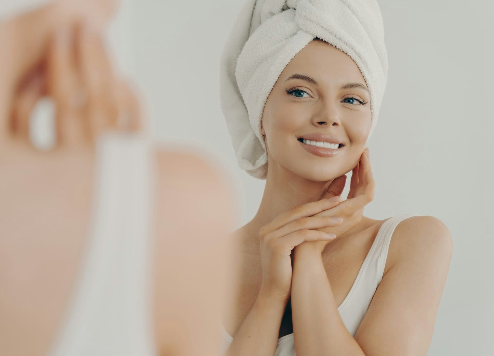 Woman with hair wrapped in towel