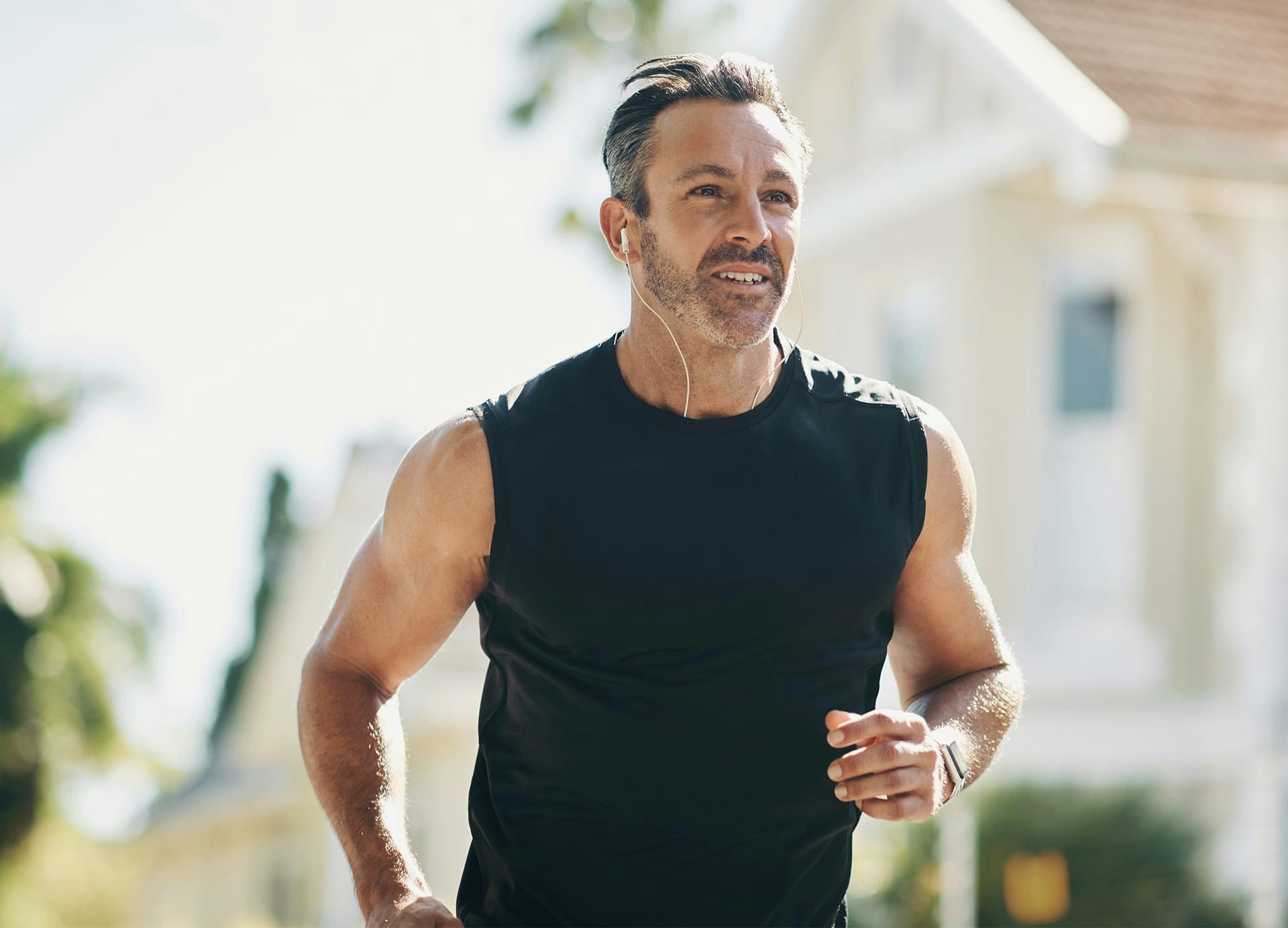 man with headphones jogging