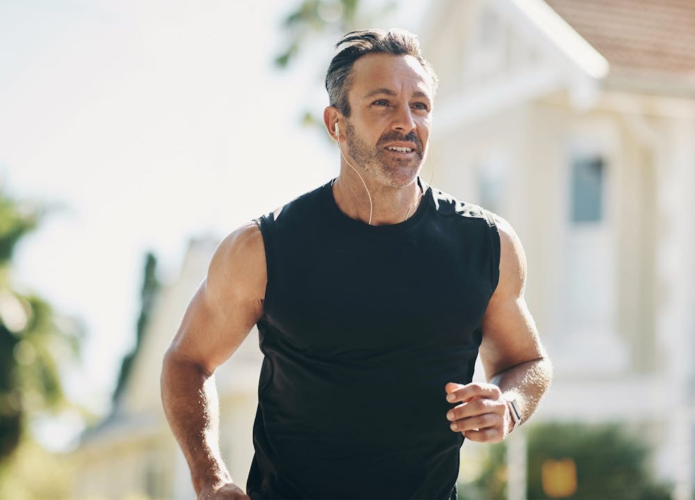 man with headphones jogging