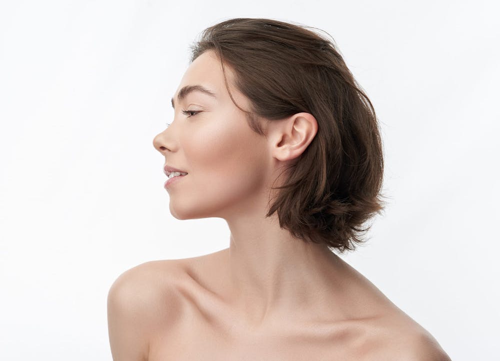 woman showing off cheek