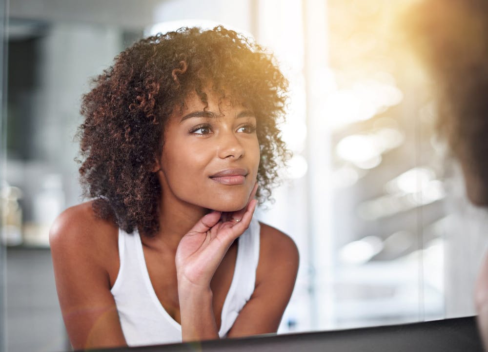 Woman looking in mirror