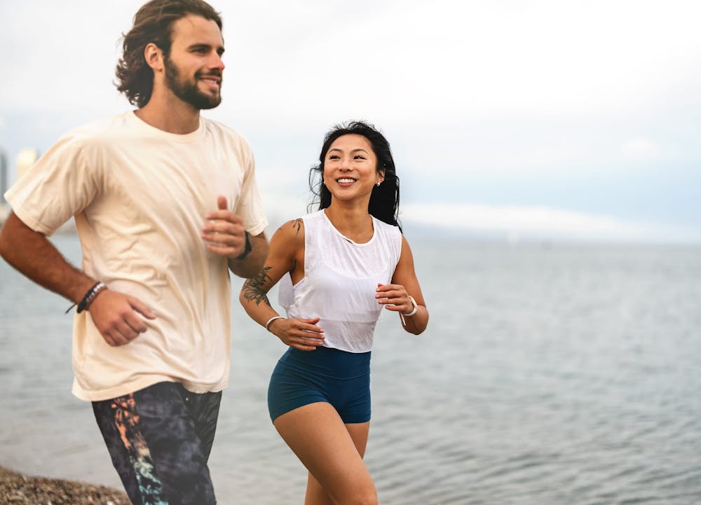 couple running on beach
