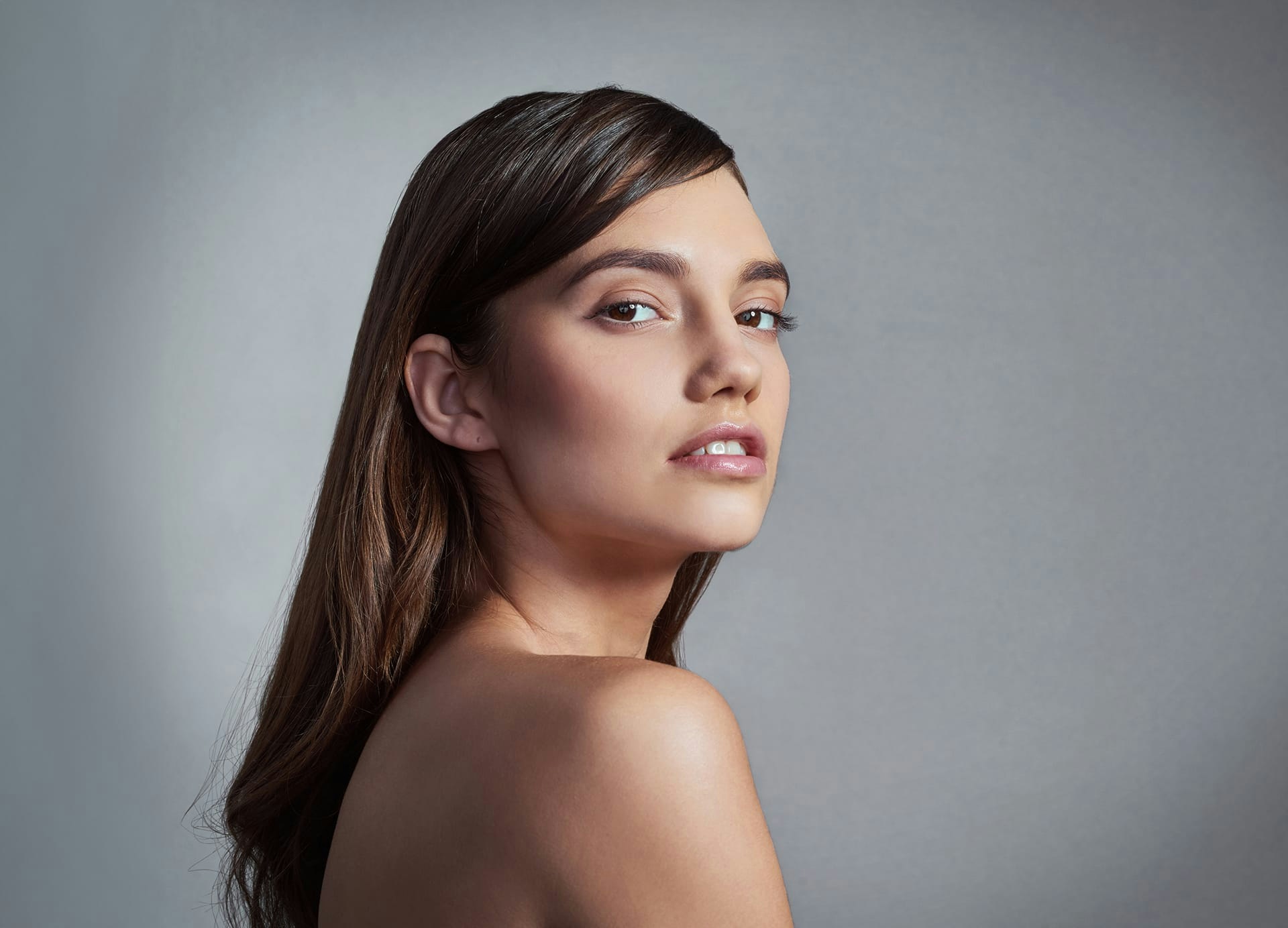 woman smiling over shoulder