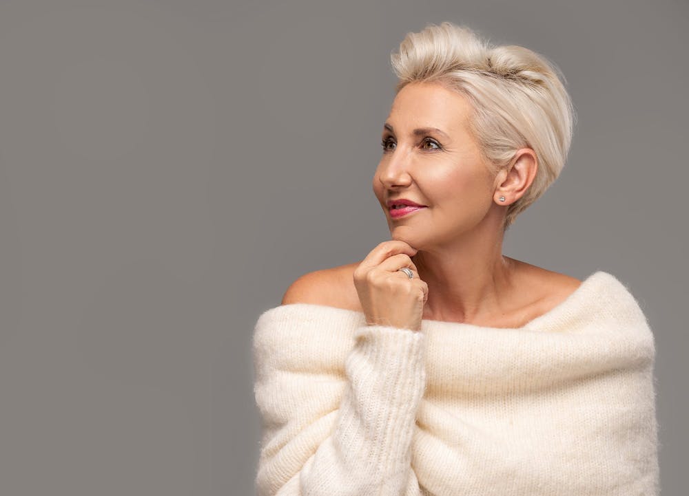 smiling woman in sweater