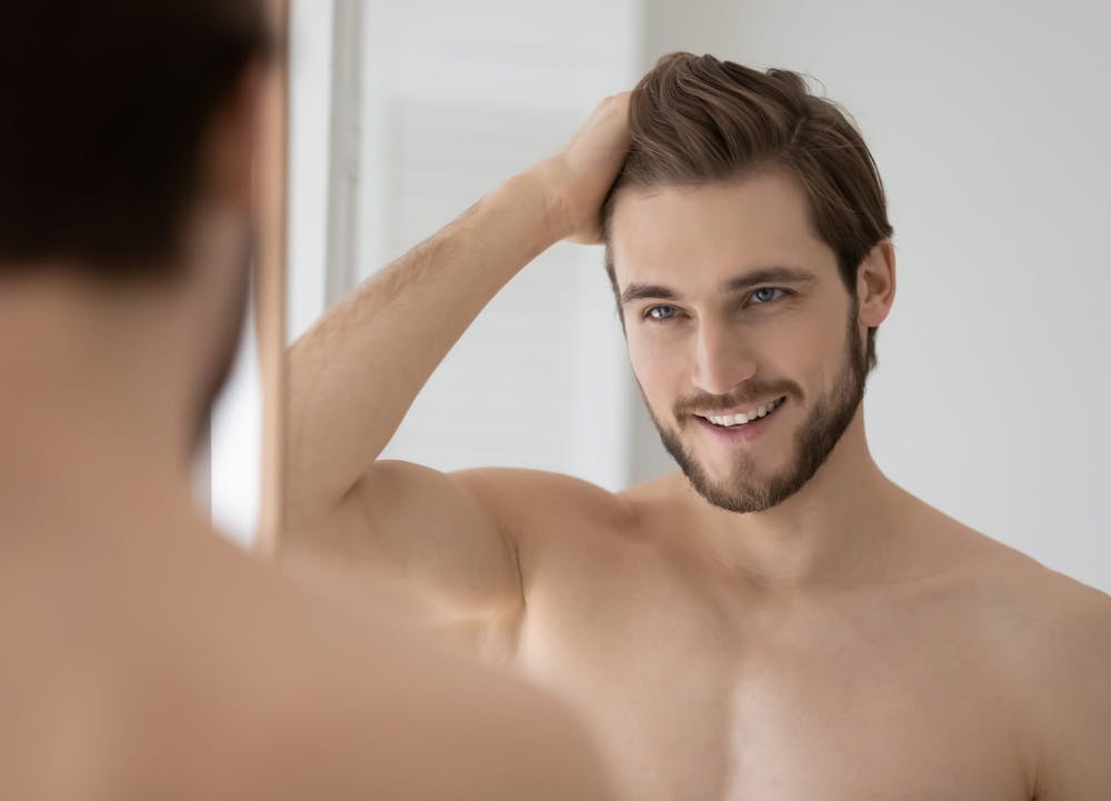 man running hand through hair