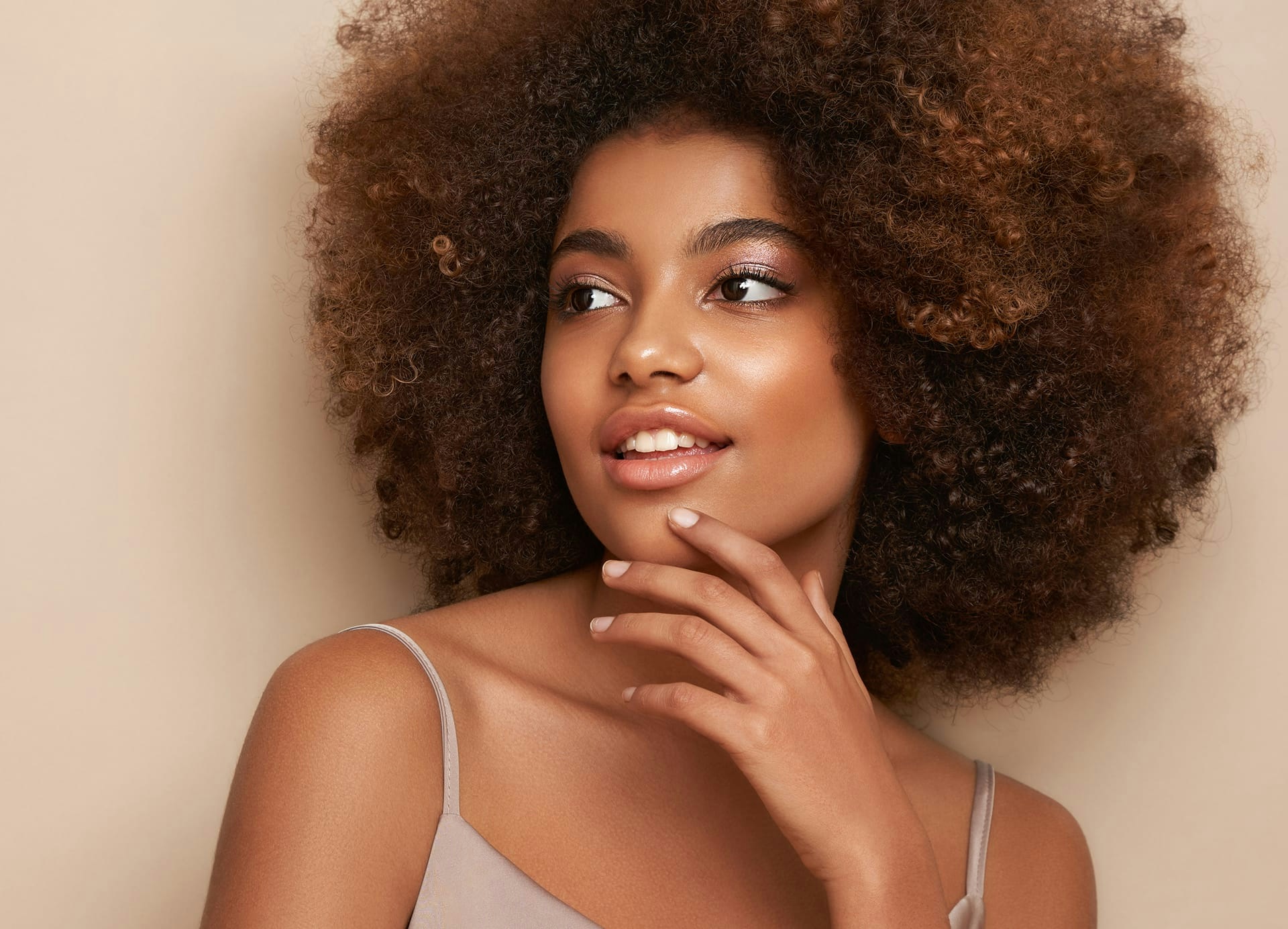 smiling woman with afro