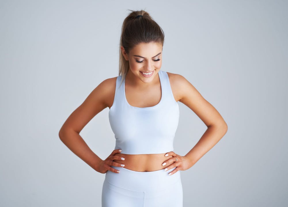 woman in white gym attire