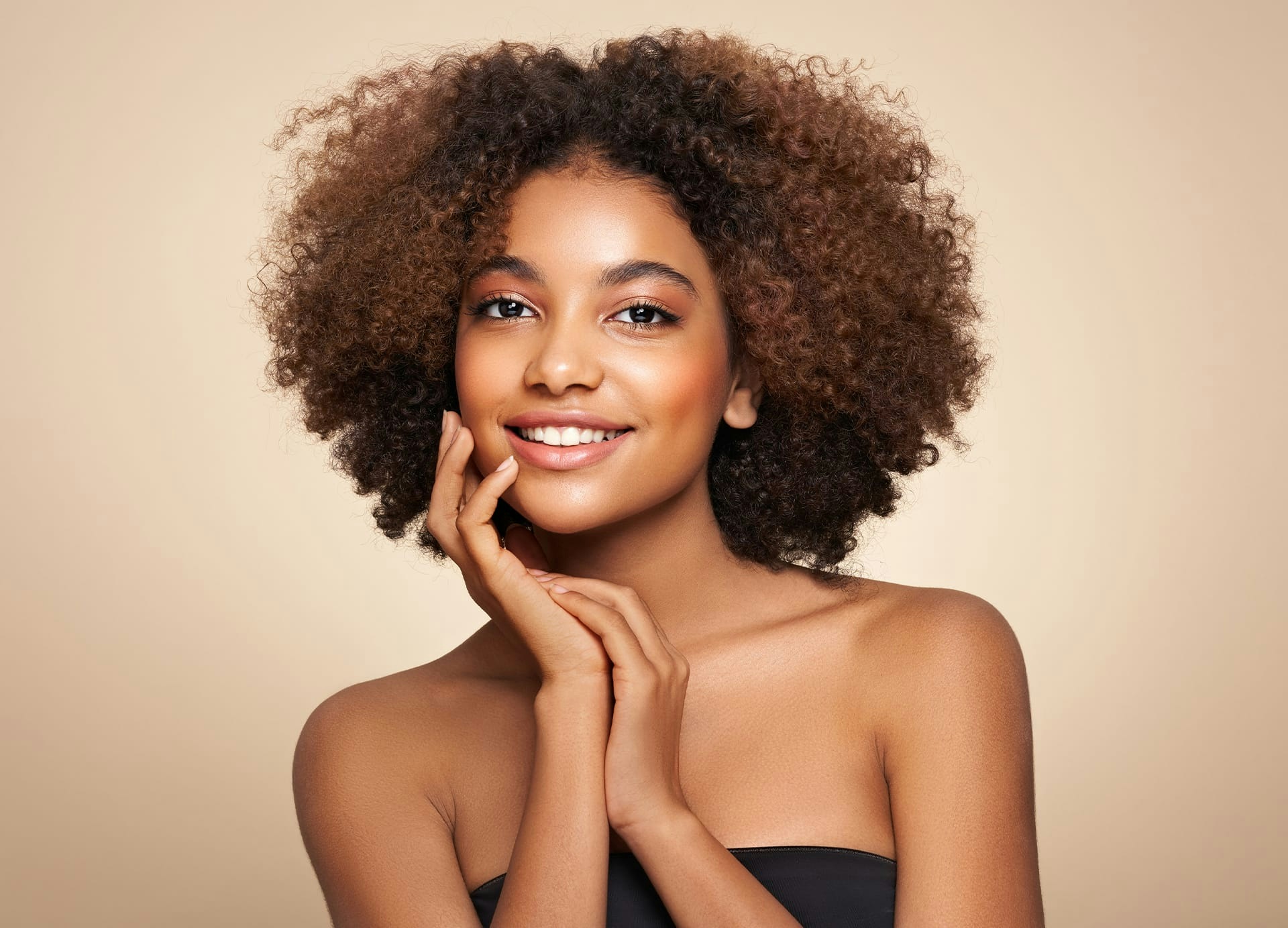 smiling woman with curly hair