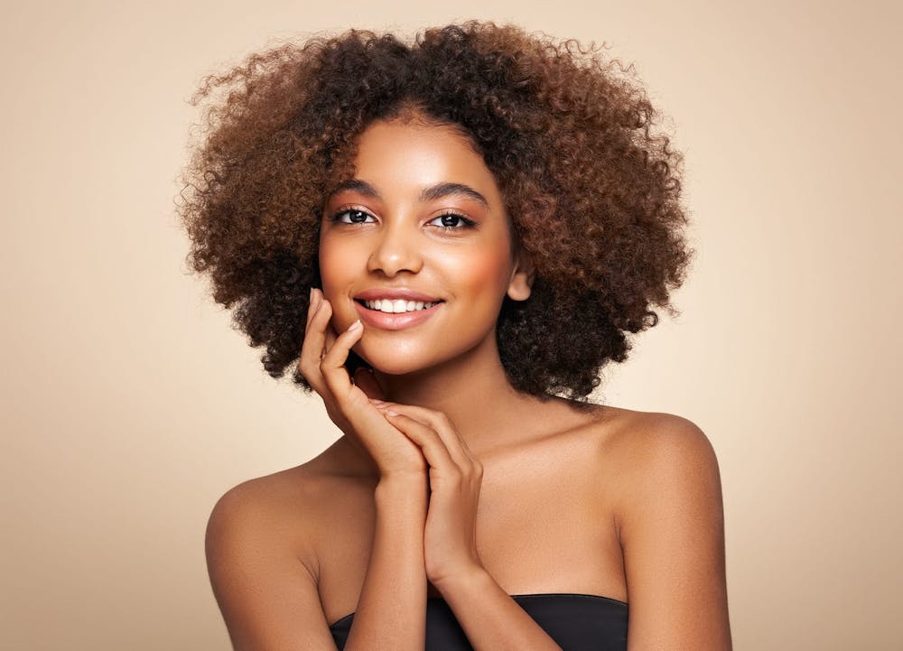 smiling woman with curly hair