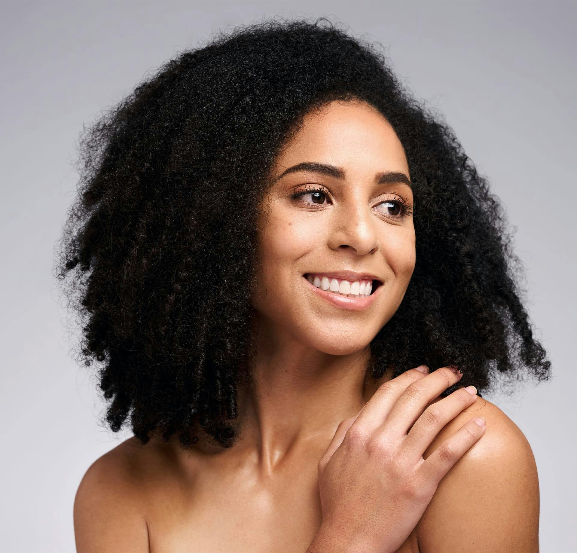 smiling woman with curly hair