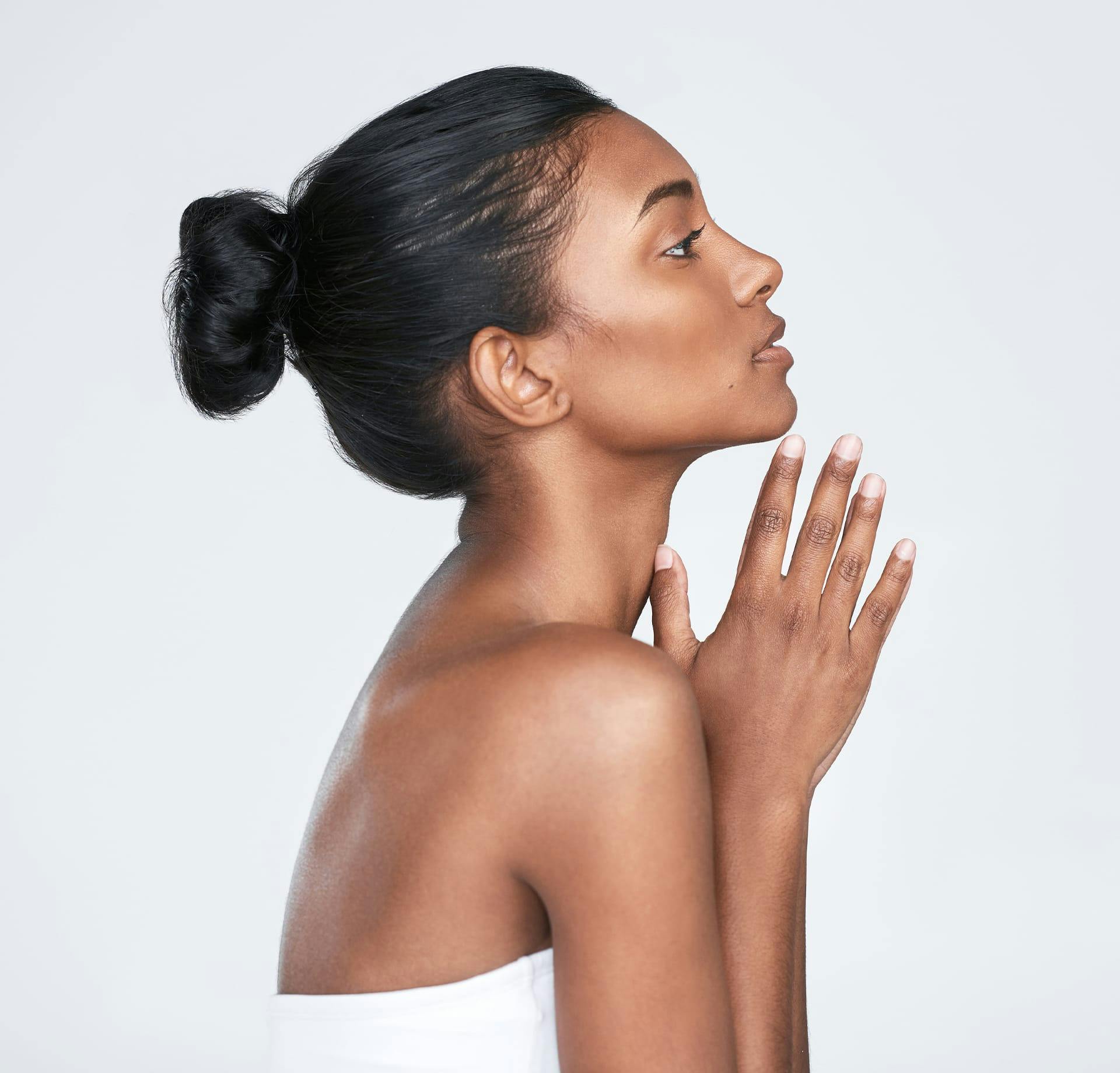 woman with hands pressed together