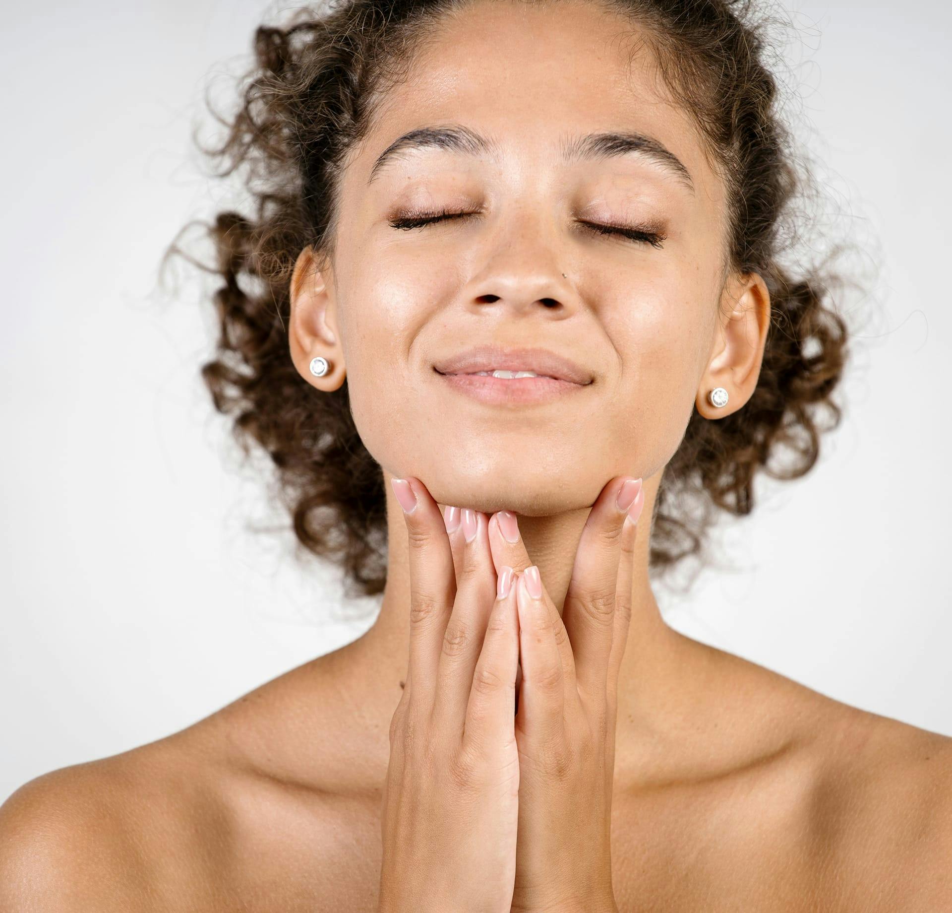 smiling woman holding chin