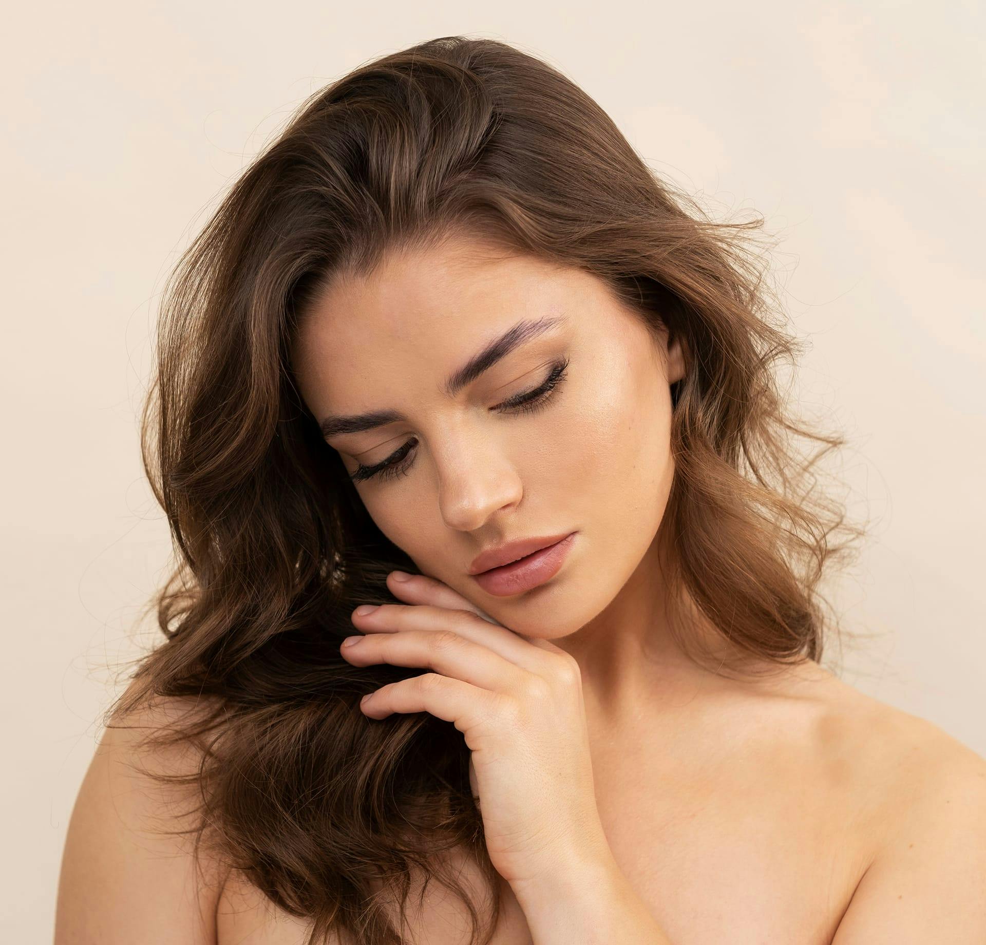 woman resting hand on chin