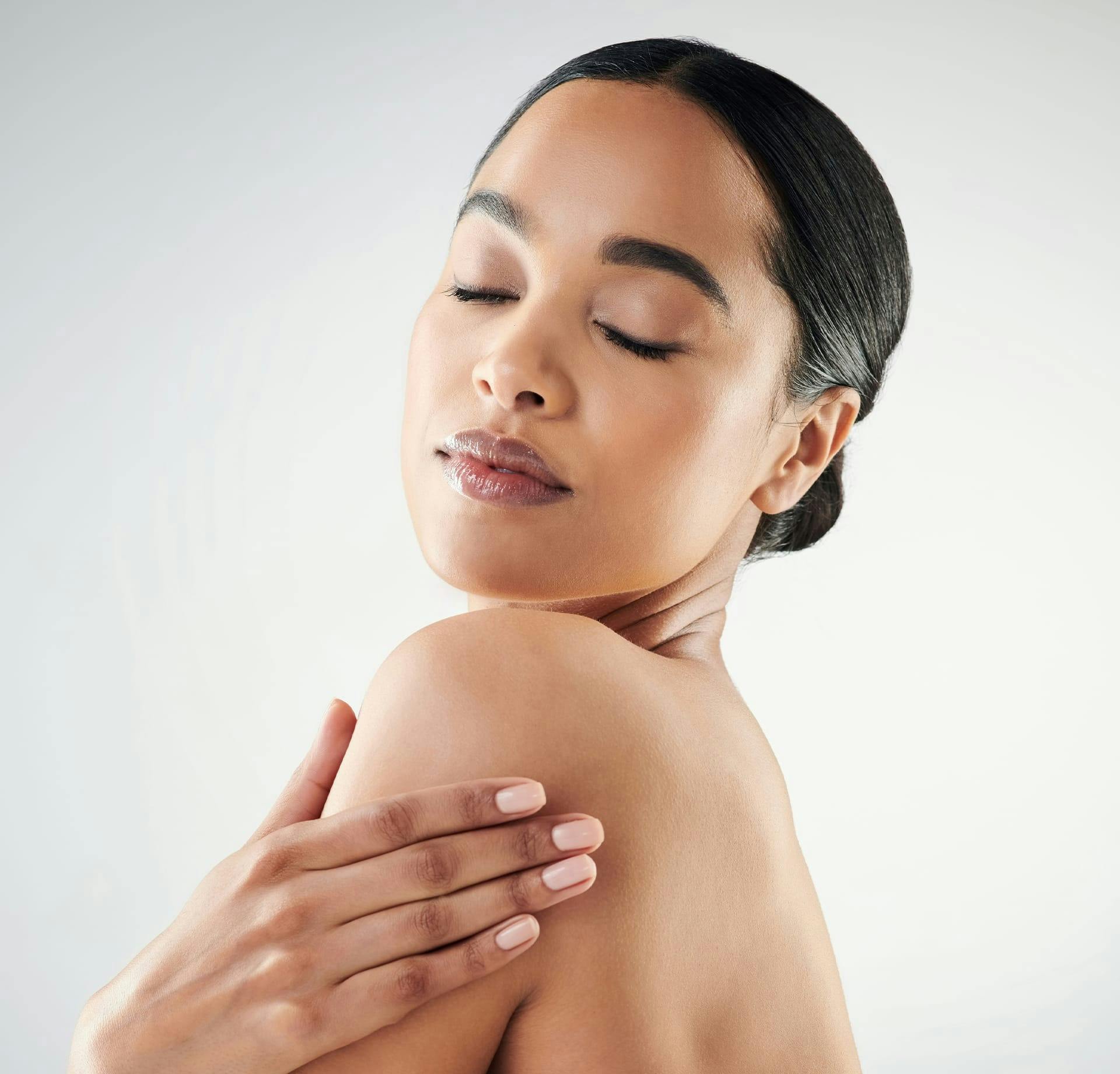 Woman caressing shoulder