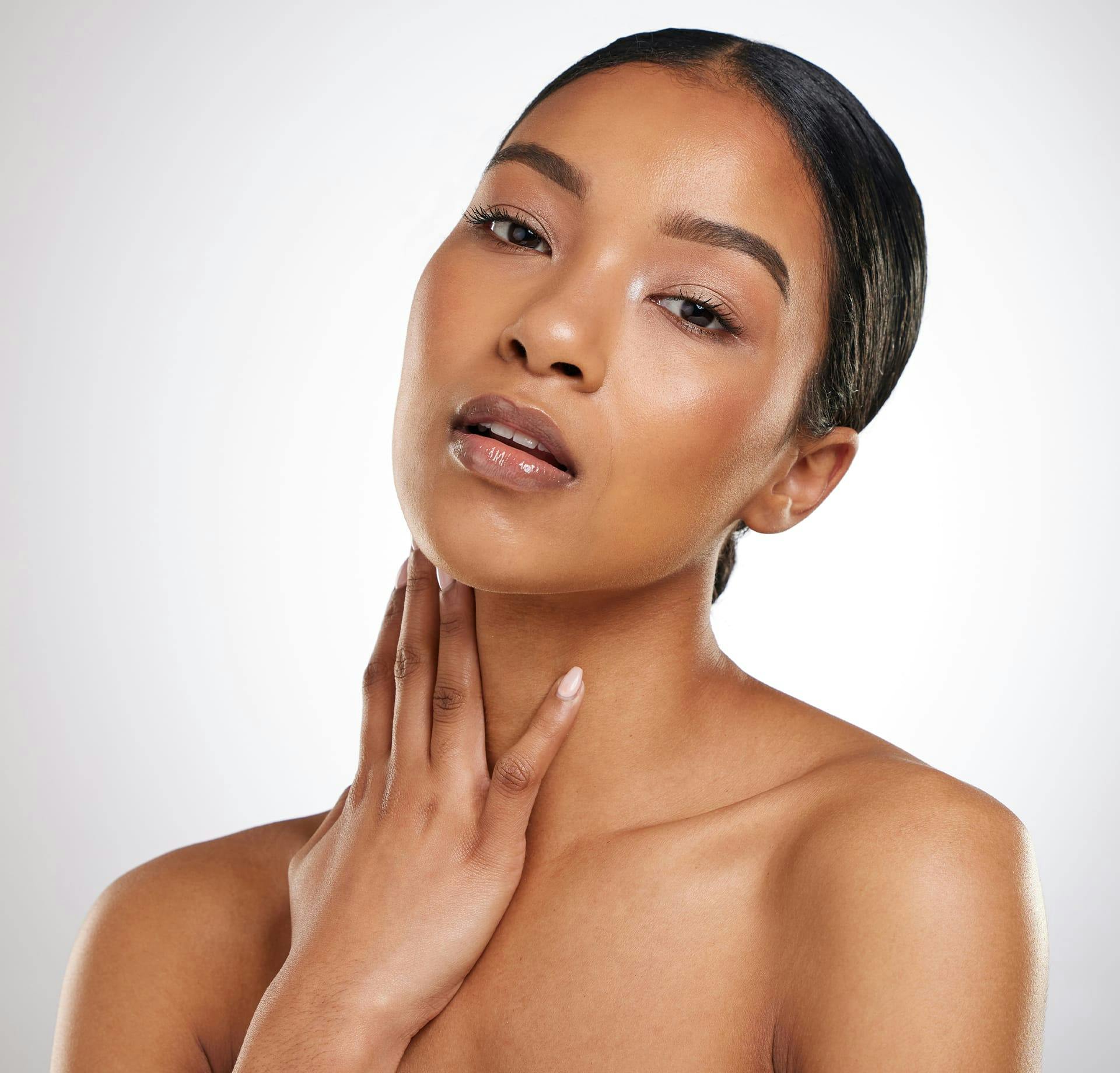 woman caressing her neck